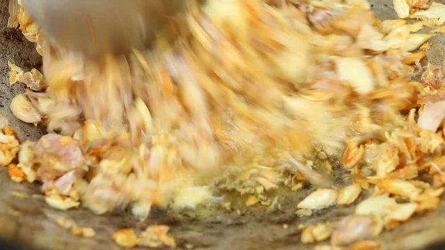 Frying chopped garlic in pan, Chiangmai Thailand
