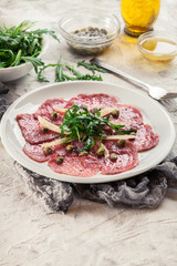 Beef carpaccio with arugula and parmesan