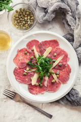 Beef carpaccio with arugula and parmesan
