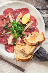 Beef carpaccio with arugula and parmesan