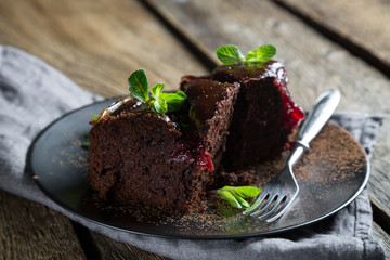 Chocolate brownie with jam and fresh mint