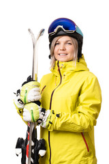 Smiling girl in helmet holding skis