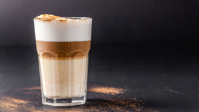 A Modern, Lactose-free Latte Or Cappuccino Coffee With Almond Milk. Above The Fire Sugar Burned Sugar. Caramel Crust. Drink In A Glass Tumbler. Copy Space