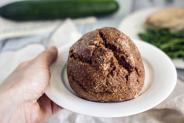 Wholegrain low-calorie bread with flaxseeds from wheat, rye and barley seedlings. Healthy bread for a healthy diet