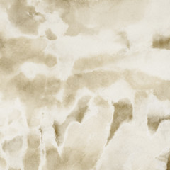 Gold luxury ink and watercolor textures on white paper background. Paint leaks and ombre effects. Hand painted vintage texture.