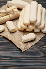 Italian Savoiardi ladyfingers Biscuits on wooden backgound with copy space