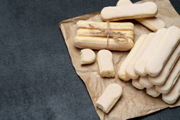 Italian Savoiardi ladyfingers Biscuits on concrete backgound