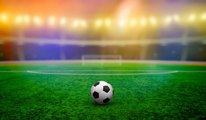 Soccer ball on stadium with illumination