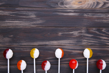 Lollipops on brown background. sweet candy concept
