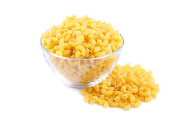 Uncooked elbow macaroni in bowl isolated on white background.