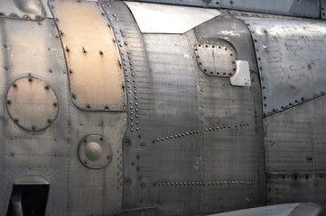 Titanium and steel plates of the military fighter close up