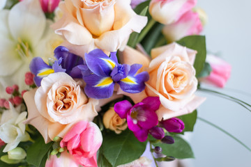 image of a girl in apron holding a flower in her hands with a manicure on a white background