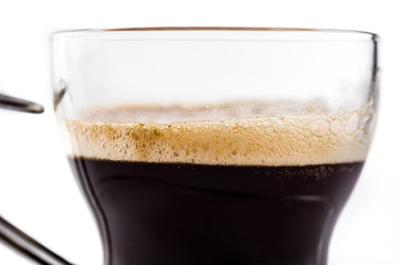 Hot espresso coffee glass isolated on white background. Close up