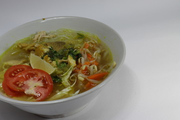 a bowl of Soto, an Indonesian most popular food