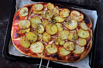 Homemade potato pizza. Vegan pizza. Top view. Eco food.