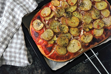 Homemade potato pizza. Vegan pizza. Top view. Eco food.