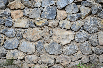 Real stone wall background.