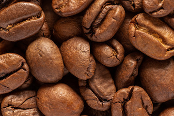 Roasted natural organic brown coffee beans, can be used as a background, macro shot