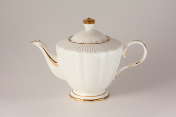 Beautiful white porcelain teapot on white background.