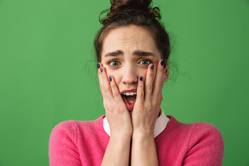 Portrait of a shocked young woman standing