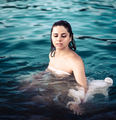 Portrait of a beautiful woman in a sea