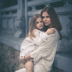 Beautiful portrait of a mother holding daughter