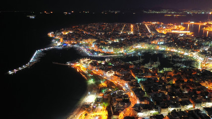 Aerial drone night shot of famous small safe port of Mikrolimano with sailboats docked, Piraeus, Attica, Greece