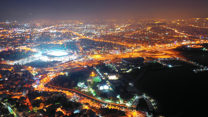 Aerial drone night shot of famous small safe port of Mikrolimano with sailboats docked, Piraeus,...