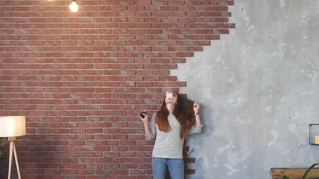 Sexy girl smokes vape.