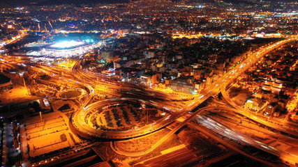 Aerial drone night shot of multilevel junction highway with moderate traffic