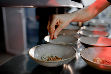 the chef throws the species into food