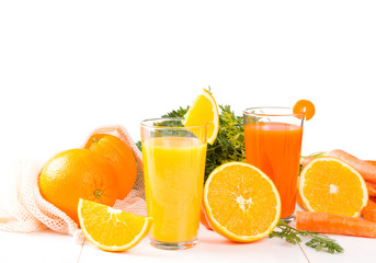 Fresh juices, Orange and carrot drink with fruits and vegetable on wooden table. 