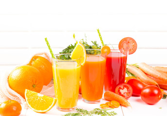 Fresh juices, Orange, Carrot, Apple, Tomato drinks with fruits and vegetables on wooden table. 