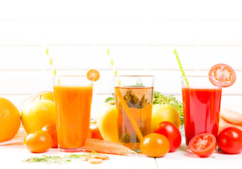 Fresh juices, Orange, Carrot, Apple, Tomato drinks with fruits and vegetables on wooden table. 