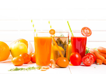 Fresh juices, Orange, Carrot, Apple, Tomato drinks with fruits and vegetables on wooden table. 
