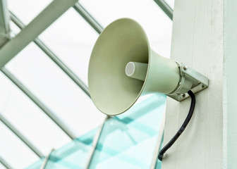 White megaphone, large alert loudspeaker close-up.