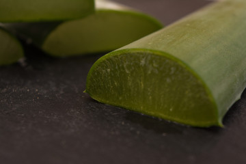 Sliced aloe vera on black background