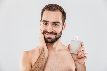 Portrait of a cheerful shirtless bearded man