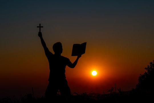 Symbol of God love to people the mountain at sunset