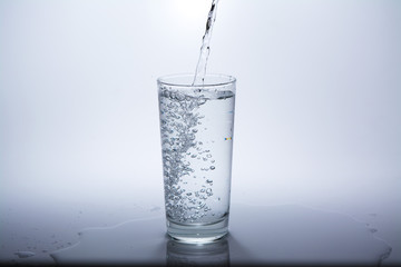 Pure water is poured into a glass