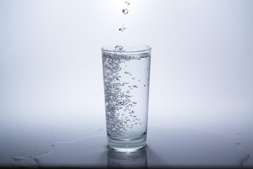 Pure water is poured into a glass