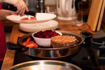 cooking vegetables and steamed eggs in a saucepan