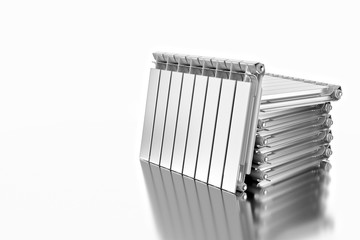 3D rendering. Central heating radiators with many sections. Many white heating radiators on white background.