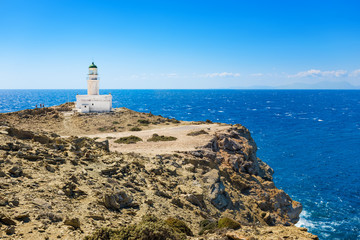 Fototapeta na wymiar White lighthouse in Prasonisi National Park – southest spot of Island (Rhodes, Greece)