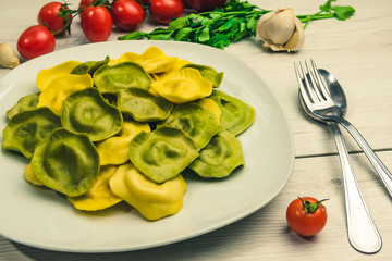 Cassic ravioli filled with basilico and cheese in a plate.