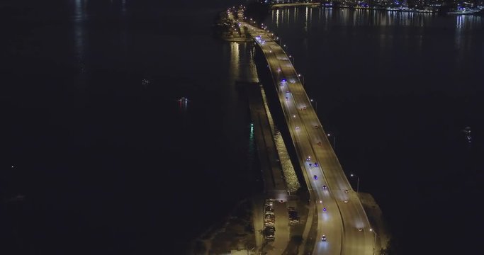 Aerial night footage Rickenbacker Causeway William Powell Bridge 4k 60p
