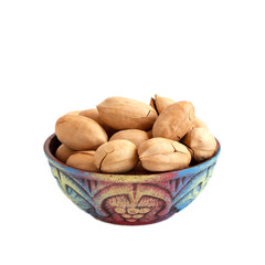 bowl with pecan nuts in shell isolated on white background
