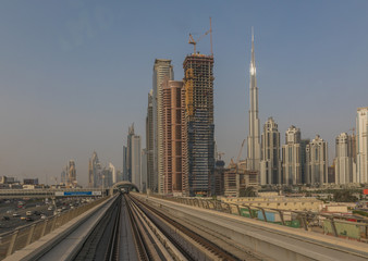 Fototapeta na wymiar Dubai, United Arab Emirates - the Dubai Metro is the fastest way to get from one side to the other of Dubai, and offers the chance to appreciate the unique skyline of the city