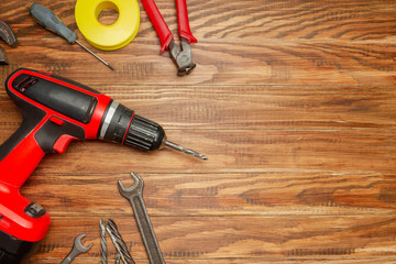 different construction tools on wooden background with copy space. diy construction tools on the...