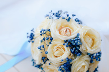 beautiful wedding bouquet with gold rings, bridal accessories
